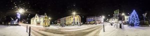 Llanwrtyd Wells Town centre in winter with Christmas lights and snow.