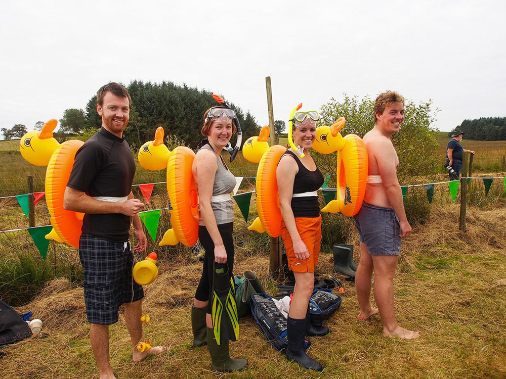 Bog snorkelling with inflatable ducks