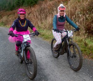 Two female mountain bikers in fancy dress